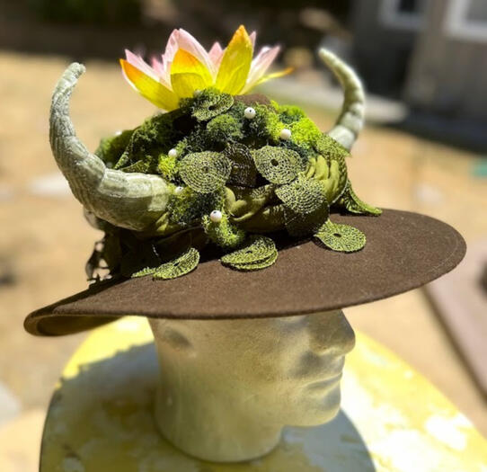Mossy brown wool sunhat with tatting lace lilypads &amp; lotus flower atop the head.