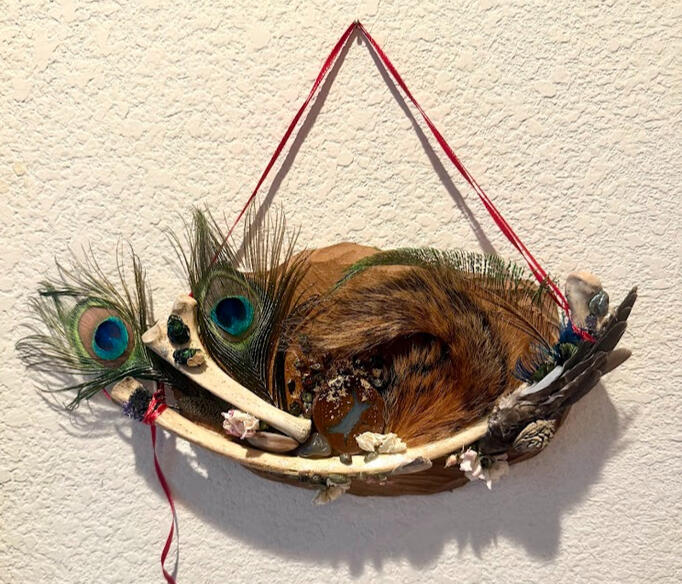 3 deer bones, 3 peacock feathers, 1 squirrel tail, 1 eurasian dove wing, bloodstone beads, mixed semi-precious stones, 1 rainbow milkweed locust wing, 2 emerald dung beetles, dried carnation, seashell, gold foil