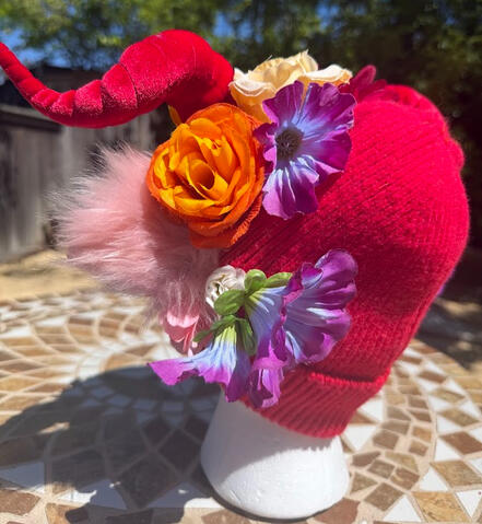 Ears are red with fluffy pink backing.