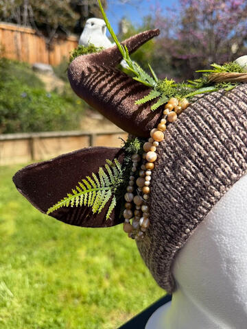 Natural tan swirled beads cascade from the antlers and ears to frame the face of the wearer. Perfect for the avian / bird lover in your life! Horns are pose-able, ears are pierceable!