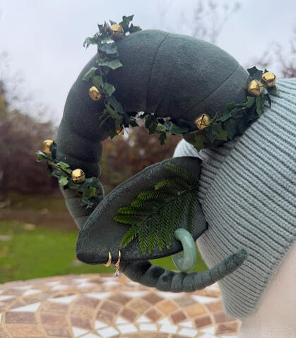 2 golden hoop earrings and one jade green earring accents both ears. These earrings are removable or repositionable if desired!