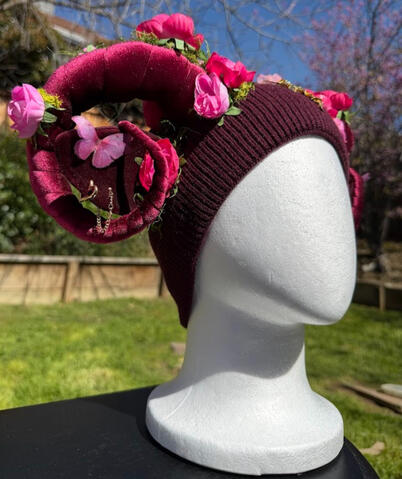 The top of the beanie features a gold metal floral accent with a light pink 3D silk butterfly. Horns are pose-able, ears are pierceable &amp; bendable.