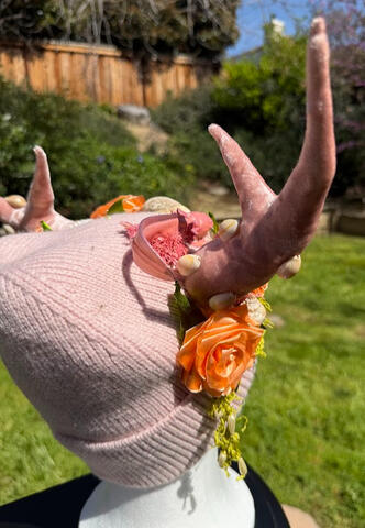 Mossy green strands of thread with pearlescent beads are sprinkled throughout. Horns are pose-able. This beanie does not have ears and it does not have an inner lining.