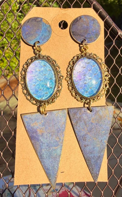 Brass & blue weathered metal studs. Metallic blue-purple shift snake shed. Approx 4" length. $30