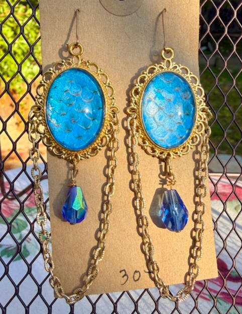Gold metals w/ beaded iridescent blue accents. Gold fish hooks. Approx 3&quot; drop. Metallic blueshift snake shed. $30
